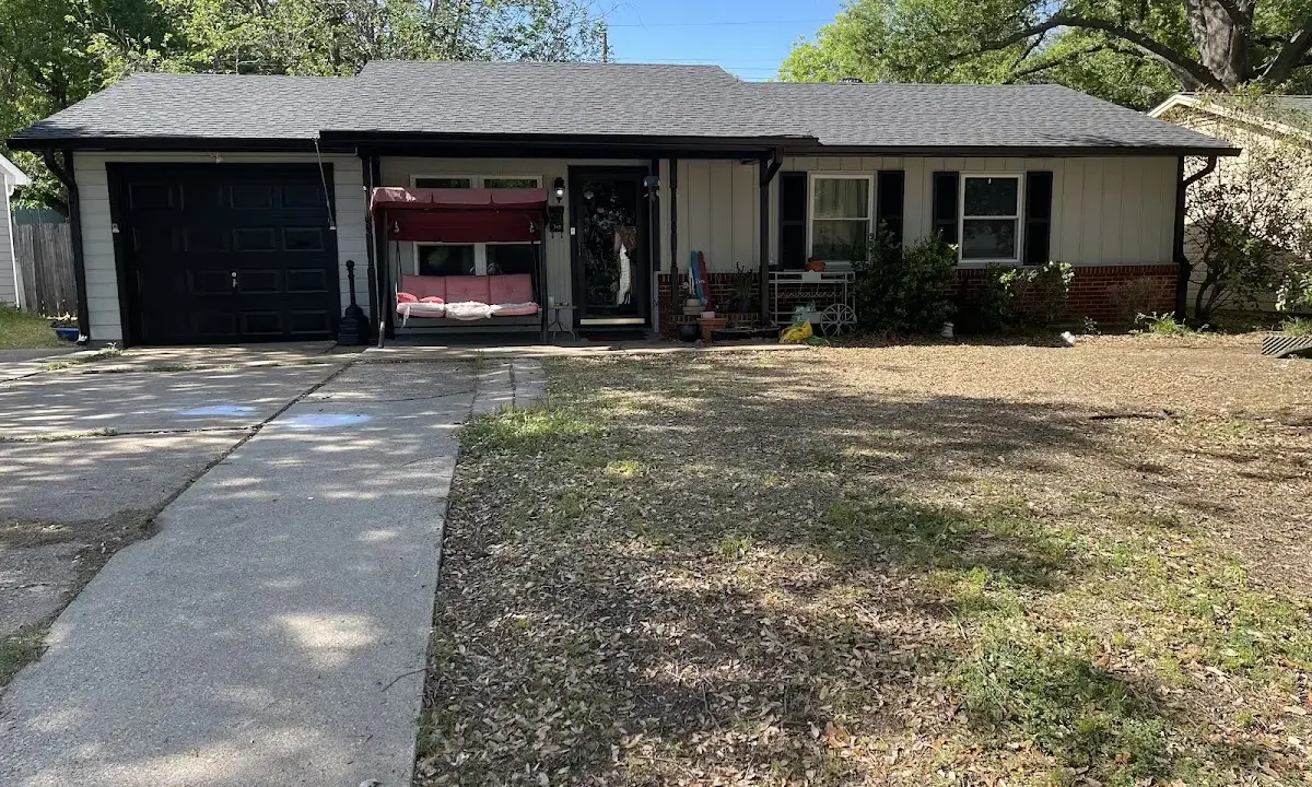 Wind Damage Roof Repair crew at work on a residential roof in Gladewater
